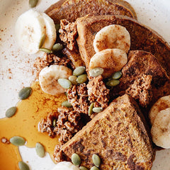 Pumpkin CinnaSpice Gluten Free French Toast With Banana and Pumpkin seeds on top